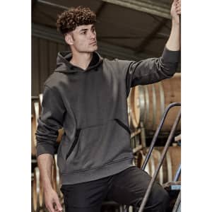 A unisex dark grey water-resistant hoodie with a front pocket and a hood, displayed in a work environment.