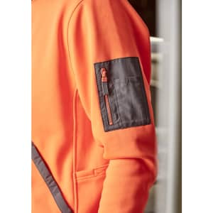 An orange unisex water-resistant hoodie features a contrast black zippered pocket on the sleeve and has a logo.