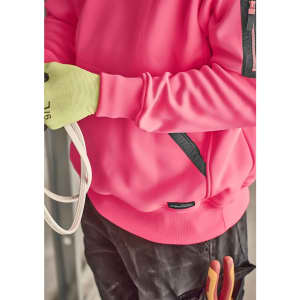 A unisex water-resistant hoodie in bright pink with black accents, worn by a person holding rope and wearing gloves.