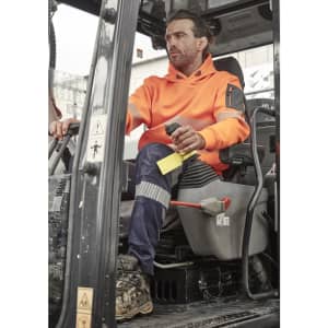 An orange water-resistant hoodie is worn by a man operating machinery, with segmented tape detail on the sleeves.