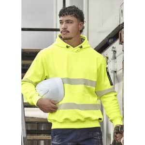 A bright yellow unisex hoodie with segmented tape and a hood, held with a white hard hat against a construction backdrop.