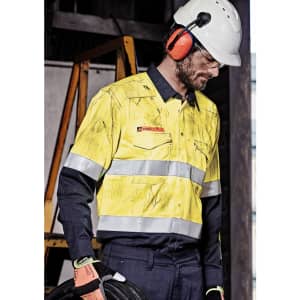A high visibility yellow and navy work shirt with hoop tape detailing, worn by a man in safety gear.