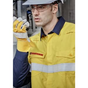 A lightweight work shirt in yellow and navy, featuring hoop tape, worn by a model with safety gear.