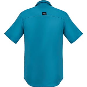 A short-sleeve button-up shirt in teal, featuring a collar and a logo on the back.