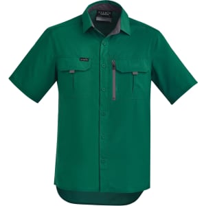 A green short sleeve button-up shirt with two front pockets and a logo on the chest.