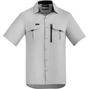 A light grey short sleeve button-up shirt with two chest pockets and a zip pocket, featuring a logo.