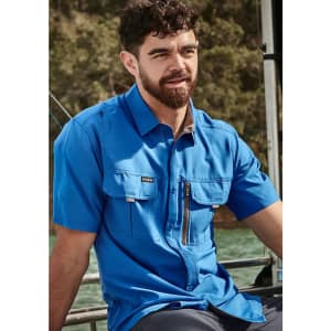 A blue outdoor short sleeve shirt features two front pockets and a zip pocket, ideal for outdoor activities.