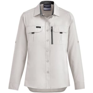 A light grey women's long sleeve button-up shirt with two front pockets and a zippered pocket. Styled for outdoor use.