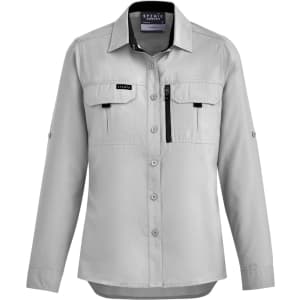 A women's long sleeve button-up shirt in light grey, featuring two front pockets and a zip pocket. It has a logo.
