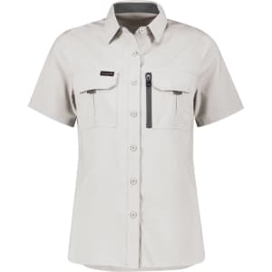 A women's short sleeve shirt in light grey with two front pockets and a zippered pocket, featuring a logo.