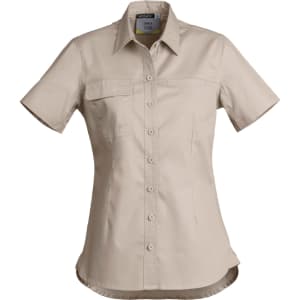 A women's lightweight short sleeve shirt in beige, featuring a button front and a chest pocket, with a logo.