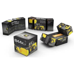A set of foldable magic cubes in black and yellow, featuring a logo and images of a loader vehicle.