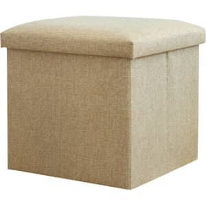 A beige foldable storage ottoman with a cushioned top, suitable for organising items in home settings.