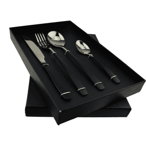A black 4-piece dinner cutlery set displayed in a black box, including a knife, fork, and two spoons.