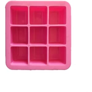 A pink silicone ice cube tray featuring nine compartments, set against a white background.