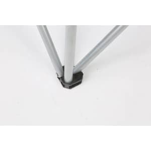 A close-up of a silver folding beach chair leg connector, featuring a black plastic base.