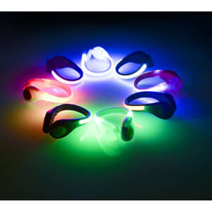 A collection of LED clip-on shoe lights in various colours, arranged in a circle against a dark background.