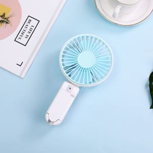 A rechargeable folding hand-held fan in white and light blue, with a circular grille design and a compact handle.