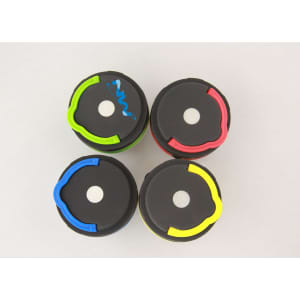 Four portable camping lights in green, blue, red, and yellow with black bases, featuring logos on some.