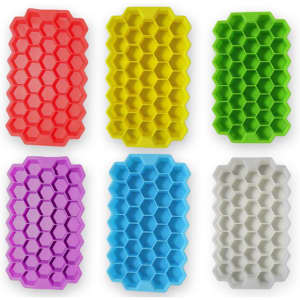 A set of silicone ice cube trays in vibrant colours: red, yellow, green, purple, blue, and white, featuring a hexagonal shape.