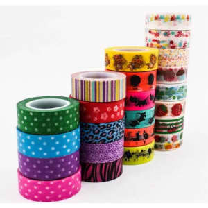 A collection of decorative washi tape rolls in various colours and patterns, including polka dots, stripes, and floral designs.