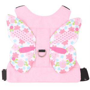 A pink backpack featuring butterfly-shaped straps adorned with flowers and polka dots, equipped with a metal ring.