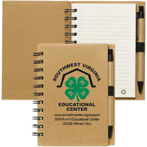 A recycled brown notebook with a pen, featuring spiral binding and lined pages. It includes a logo on the cover.