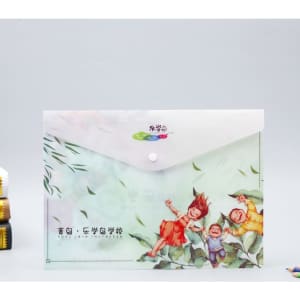 A full colour document envelope featuring a playful design with children surrounded by leaves. It has a snap button closure.