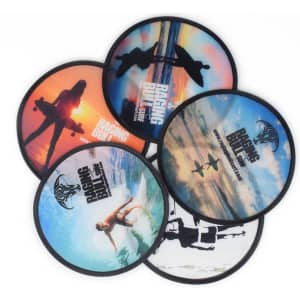 A set of six folding flying discs featuring vibrant, scenic designs in various colours and a logo.