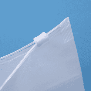 A close-up of a clear matte frosted storage bag featuring a waterproof zip-lock seal and a white clip.