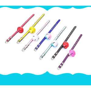A selection of pet collars with bells in various colours including red, yellow, pink, blue, black, and purple.