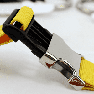 A yellow luggage belt featuring a silver buckle, designed for securing bags and luggage.
