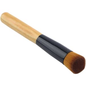 A makeup brush with a wooden handle and a black ferrule, featuring a soft, rounded bristle head.