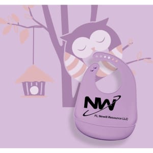 A lavender silicone baby bib with a round neck and a logo, set against a pastel background with a cartoon owl.