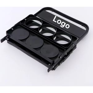 A black beer basket with four circular holders and a handle, featuring a logo on the front.
