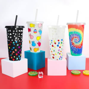 A drink bottle set featuring three 24oz colour-changing cups with straws in black, white, and vibrant tie-dye patterns.