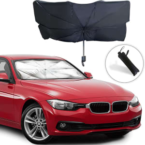 A car windshield sunshade in black, displayed above a red car, featuring an umbrella design and a carrying pouch.