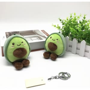 A pair of green avocado plush dolls with brown accents, featuring a keychain attachment.