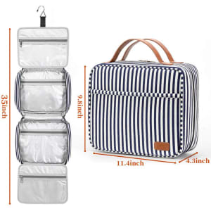 A striped navy and white hanging travel toiletry bag featuring transparent compartments and a handle for easy carrying.