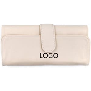 A cream-coloured makeup brush holder with a clasp closure and logo displayed on the front.