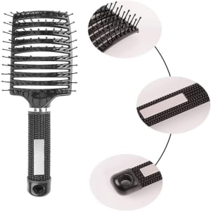 A black paddle hair brush with a textured handle and flexible bristles, featuring a logo on the handle.