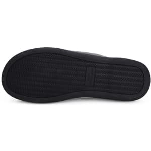 A black sole of a two-tone memory foam slipper featuring a textured design and logo.