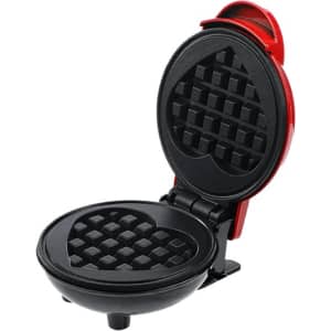 A heart-shaped baking waffle maker in red and black, featuring a non-stick cooking surface and a compact design.