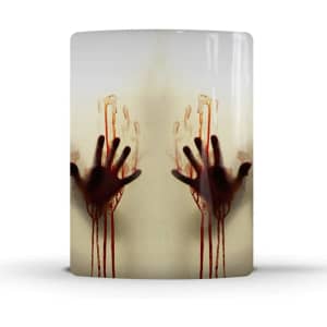 A coffee mug featuring heat-sensitive colour changing design with bloodied handprints on a light background.