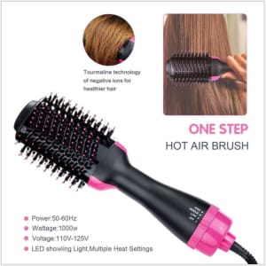 A hot air brush in black and pink features a round brush head and a handle, designed for personal hair care.