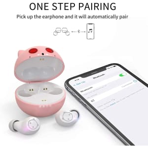 A pink cat-themed wireless earset with a charging case next to a phone displaying Bluetooth settings.
