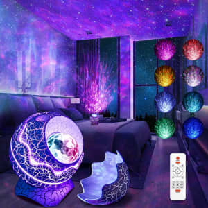 A star light projector in blue and purple, with various light settings, placed in a dimly lit room.