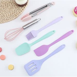 A six-piece baking tool set featuring pastel colours, including a whisk, spatula, and tongs, with a branding logo.