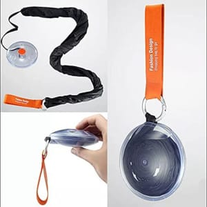 A folding telescopic storage bag with an orange handle and a black strap, featuring a clear circular casing.