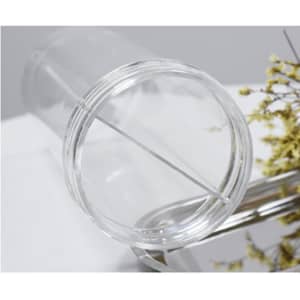A clear, compartmentalised drinking straw mug with two openings, featuring a logo and a sleek design.
